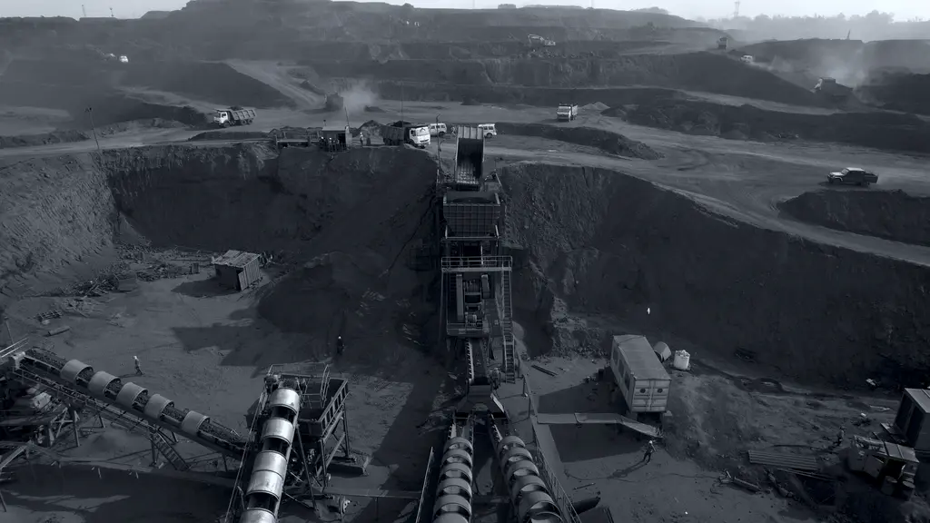 Aerial view of crushing plant operations with haul trucks working