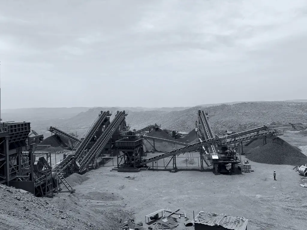 Crushing and screening plant with conveyors and stockpiles at the NMDC Sandur operations