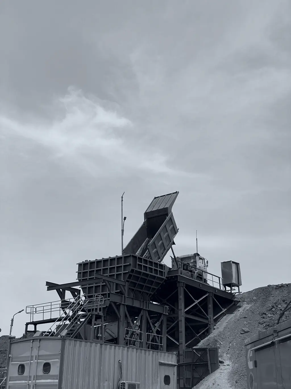 Tipper unloading run-of-mine material into a feeder hopper